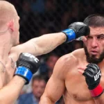 Ислам Махачев защитил титул UFC, победив Йена Гэрри с ударом головой в четвёртом раунде
